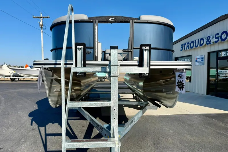 Slide: The Image of 2026 Crest Conquest 210 Fish pontoon boat on display at dealership. - 13