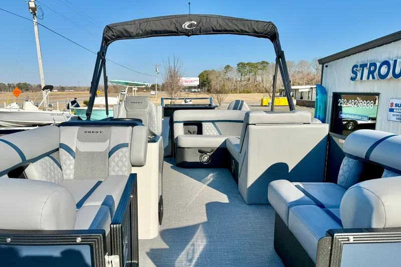 Slide: The Image of 2026 Crest Conquest 210 Fish pontoon boat with spacious seating and modern design. - 15