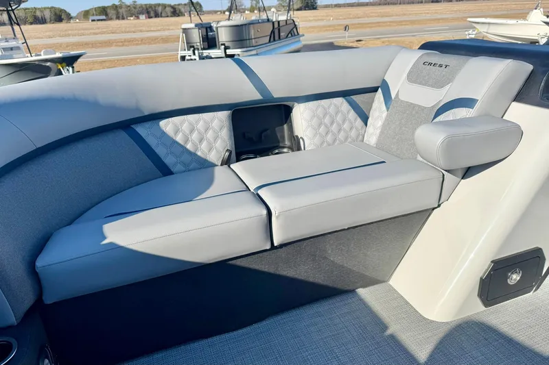 Slide: The Image of 2026 Crest Conquest 210 Fish boat interior with luxurious seating and modern design. - 17