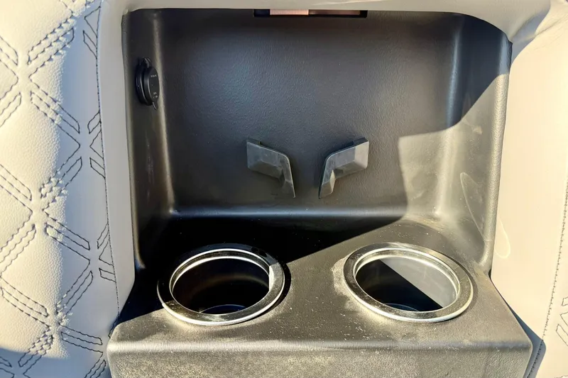 Slide: The Image of Cup holders and storage compartment in 2026 Crest Conquest 210 Fish boat interior. - 19