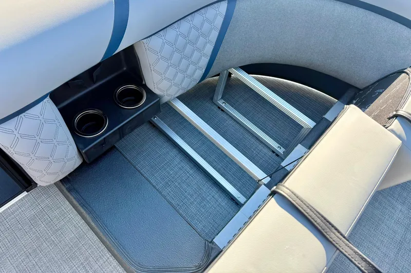 Slide: The Image of 2026 Crest Conquest 210 Fish boat interior with cup holders and seating. - 21