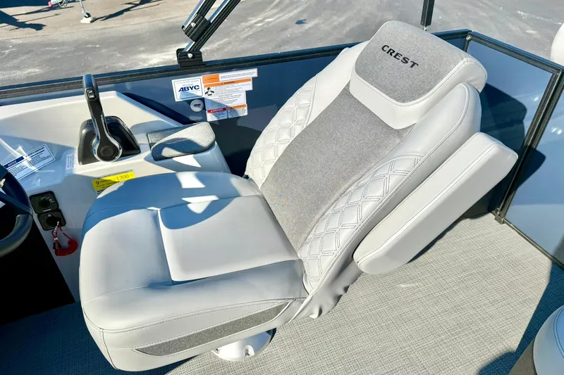 Slide: The Image of Captain's seat of 2026 Crest Conquest 210 Fish boat, featuring ergonomic design and controls. - 27