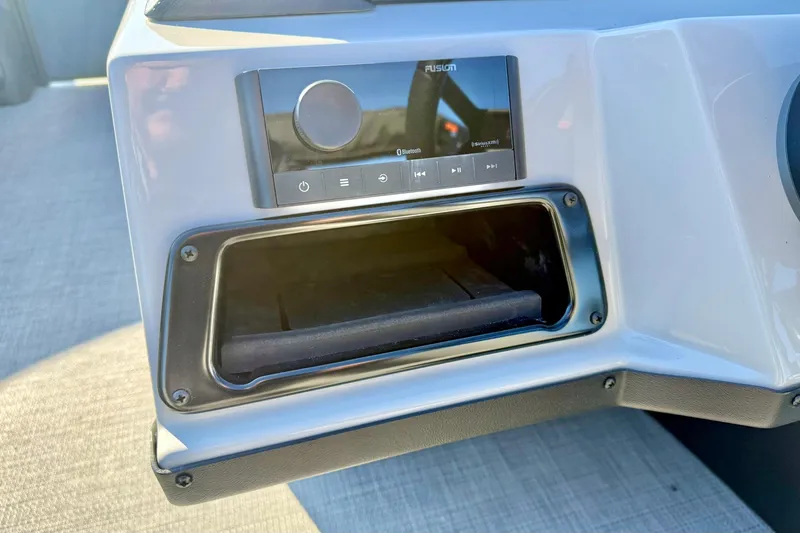 Slide: The Image of Control panel of 2026 Crest Conquest 210 Fish boat with Fusion audio system. - 29