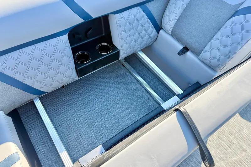 Slide: The Image of 2026 Crest Conquest 210 Fish boat seating with cup holders and storage area. - 34