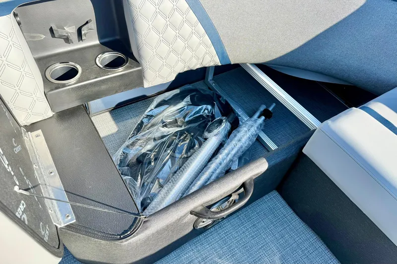 Slide: The Image of Interior of 2026 Crest Conquest 210 Fish boat with storage and cup holders. - 37