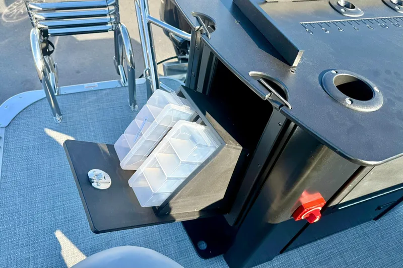 Slide: The Image of 2026 Crest Conquest 210 Fish boat with tackle storage and fishing accessories. - 46