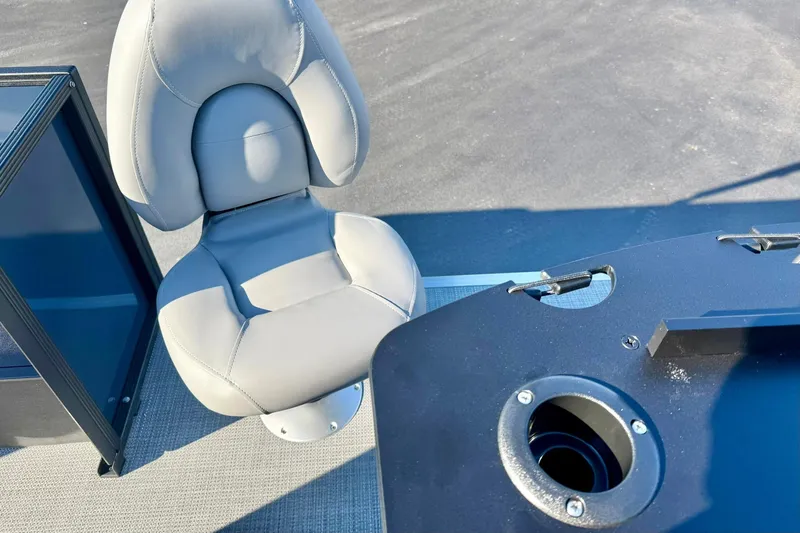 Slide: The Image of 2026 Crest Conquest 210 Fish boat seat and console, featuring sleek design and modern materials. - 50