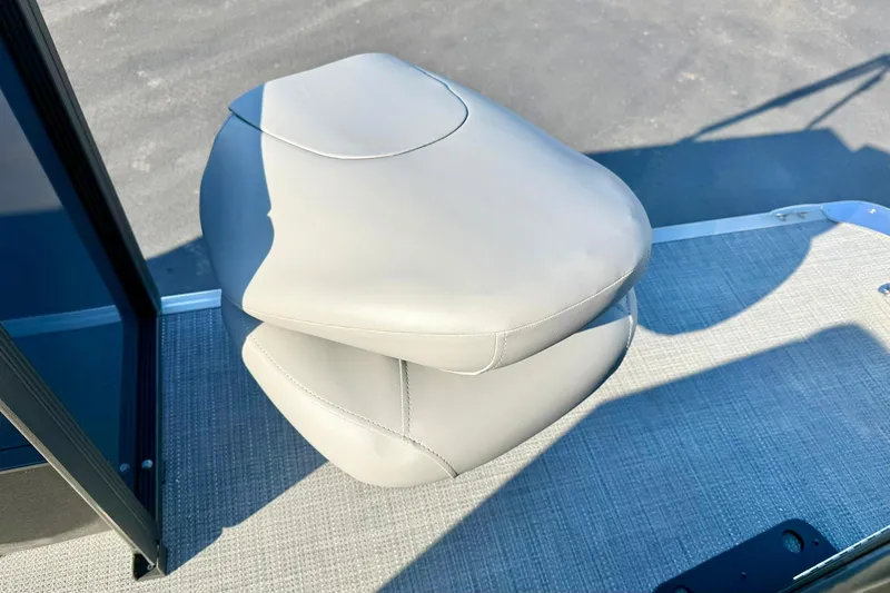 Slide: The Image of 2026 Crest Conquest 210 Fish boat seat, beige leather, on textured flooring. - 51