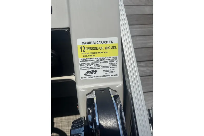 Slide: The Image of 2023 Cypress Cay Seabreeze 232 capacity label, 12 persons or 1620 lbs, 115 HP motor. - 12