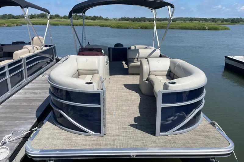 Slide: The Image of 2023 Cypress Cay Seabreeze 232 pontoon boat docked on a sunny day. - 3