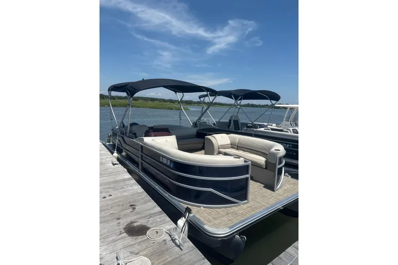 Slide: The Image of 2023 Cypress Cay Seabreeze 232 pontoon boat docked on a sunny day. - 4