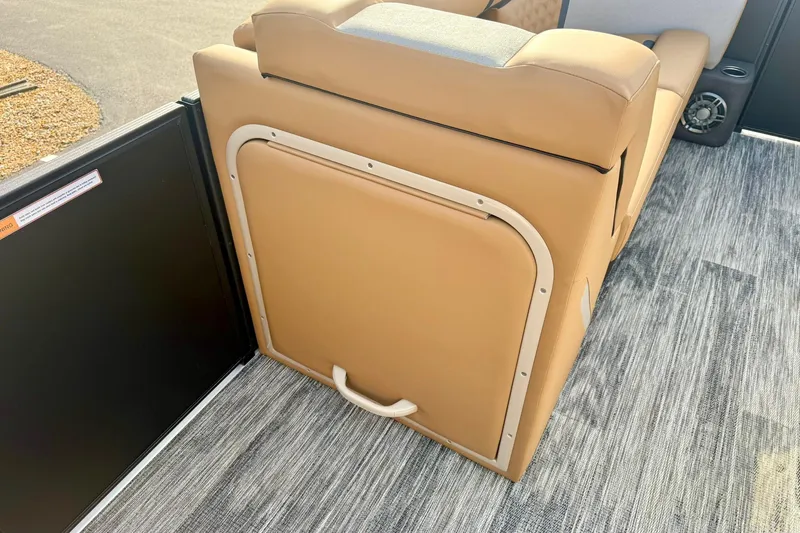 Slide: The Image of 2026 Crest Conquest 230 SLRC boat interior with tan seating and modern flooring. - 21