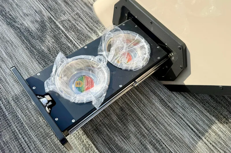 Slide: The Image of Pull-out pet feeding station on 2026 Crest Conquest 230 SLRC boat. - 23