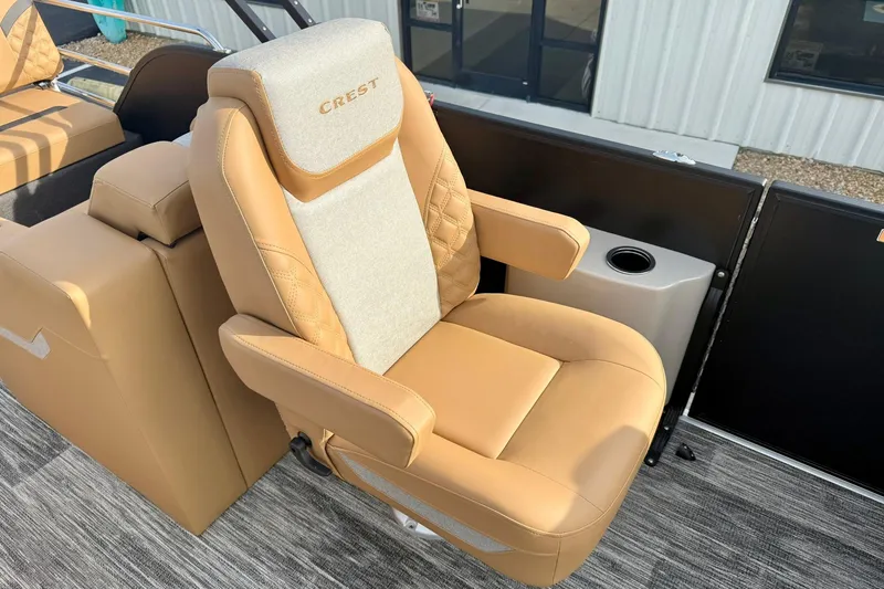 Slide: The Image of Luxurious tan seating on 2026 Crest Conquest 230 SLRC boat, featuring elegant design and comfort. - 25