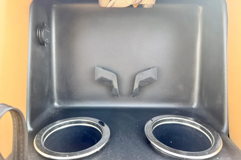 Slide: The Image of Cup holders and storage compartment in 2026 Crest Conquest 230 SLRC boat interior. - 16