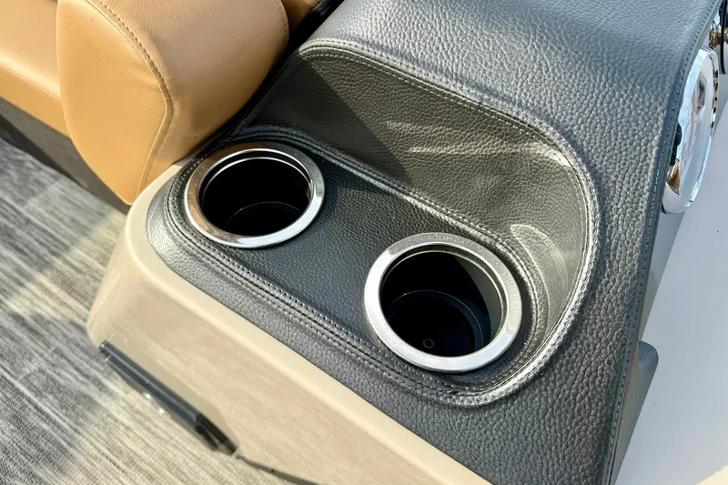 Slide: The Image of Cup holders in 2026 Crest Conquest 230 SLRC boat with leather trim. - 20