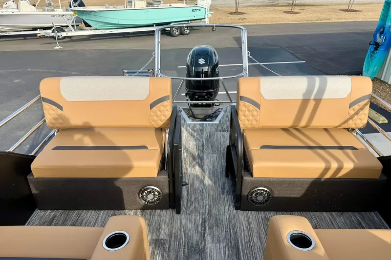 Slide: The Image of 2026 Crest Conquest 230 SLRC boat interior with tan seating and modern design. - 30