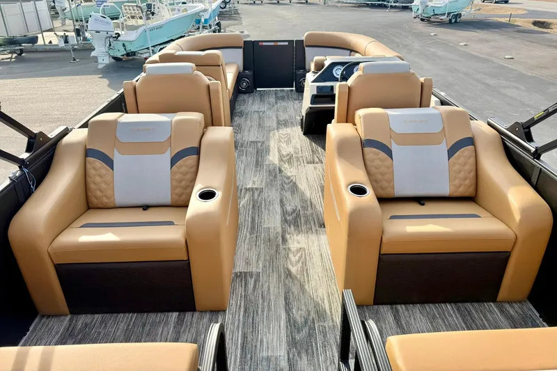 Slide: The Image of 2026 Crest Conquest 230 SLRC pontoon boat with luxurious tan seating and modern design. - 33