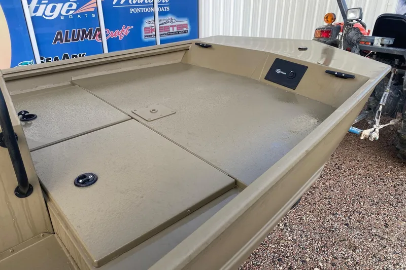 Slide: The Image of 2026 G3 Gator Tough 18 CCJ boat deck, beige color, displayed outdoors. - 11