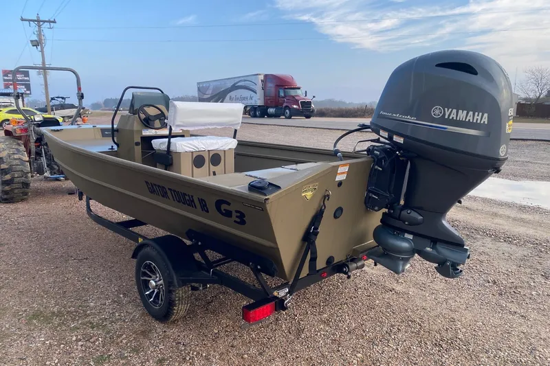 Slide: The Image of 2026 G3 Gator Tough 18 CCJ boat with Yamaha outboard motor on a trailer. - 4