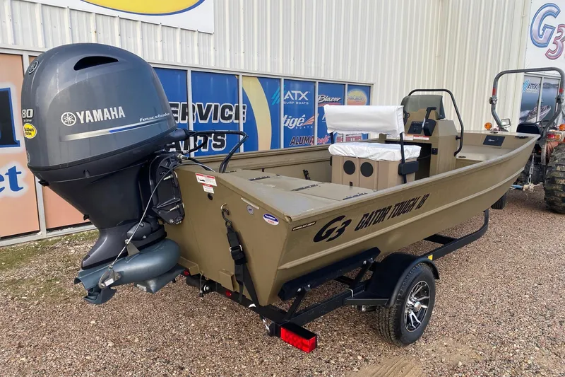Slide: The Image of 2026 G3 Gator Tough 18 CCJ boat with Yamaha engine, displayed outdoors. - 7