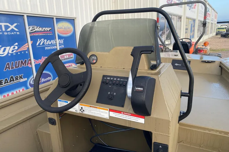 Slide: The Image of 2026 G3 Gator Tough 18 CCJ boat console with steering wheel and Yamaha controls. - 8