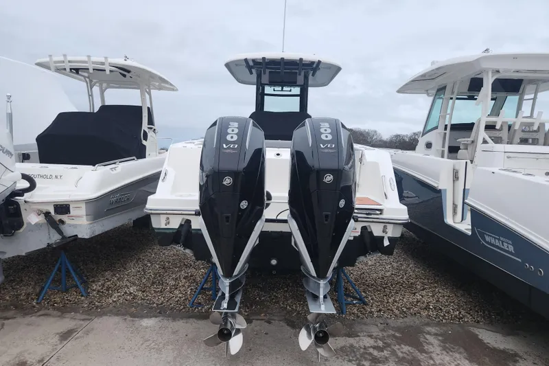 Slide: The Image of 2023 Boston Whaler 280 Outrage Trade In with dual Mercury 300 V8 engines. - 2