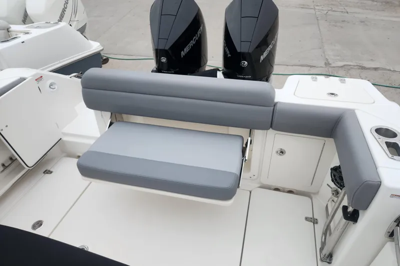 Slide: The Image of 2023 Boston Whaler 280 Outrage boat with dual Mercury engines and cushioned seating. - 3