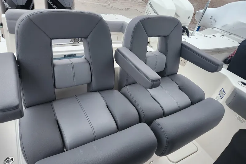 Slide: The Image of 2023 Boston Whaler 280 Outrage Trade In, featuring luxurious gray seating. - 6