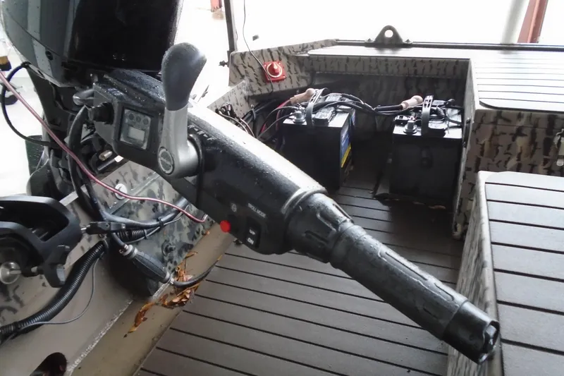 Slide: The Image of 2021 Pro-Drive SBX Series 17' boat interior with control handle and batteries. - 8