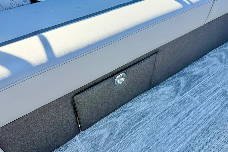 Slide: The Image of 2026 Crest Conquest 235 SLSC boat seat with storage compartment and modern design. - 20