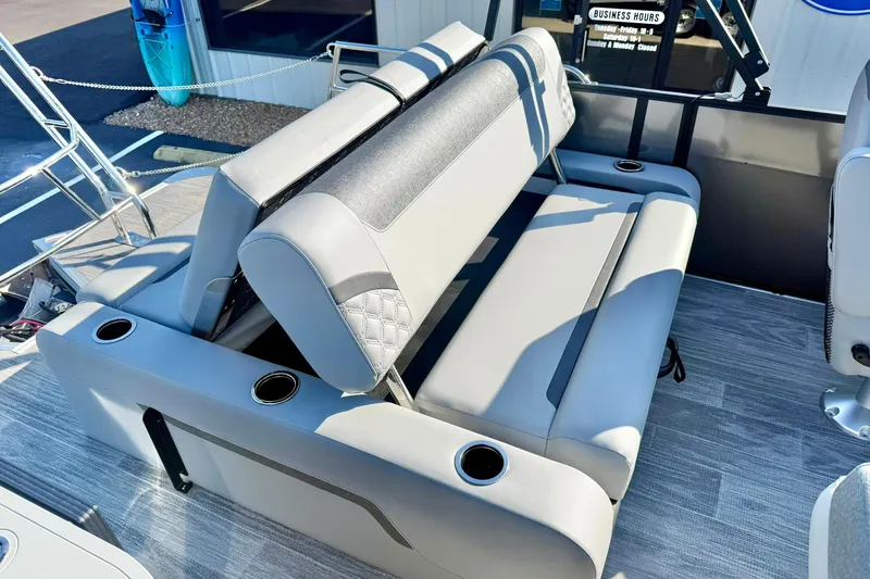 Slide: The Image of 2026 Crest Conquest 235 SLSC boat interior with gray seating and cup holders. - 46