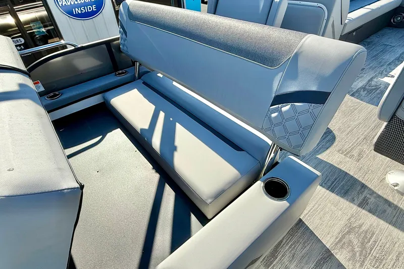 Slide: The Image of 2026 Crest Conquest 235 SLSC boat interior with gray seating and cup holders. - 48