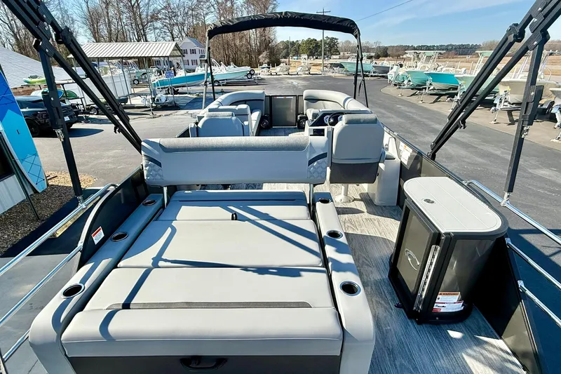 Slide: The Image of 2026 Crest Conquest 235 SLSC pontoon boat interior with seating and storage. - 51