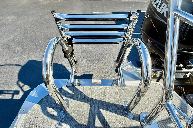 Slide: The Image of 2026 Crest Conquest 235 SLSC boat ladder and railing, featuring sleek chrome finish. - 55