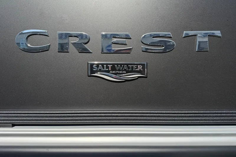 Slide: The Image of 2026 Crest Conquest 235 SLSC Salt Water Series logo on dark background. - 9