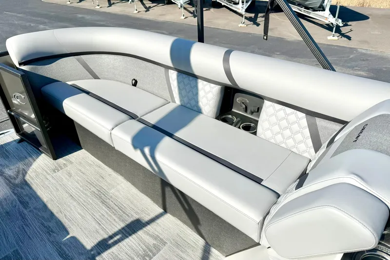 Slide: The Image of Luxurious seating on 2026 Crest Conquest 235 SLSC pontoon boat with cup holders and stylish upholstery. - 22