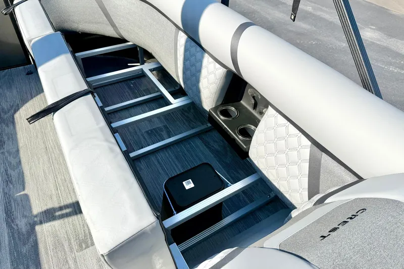 Slide: The Image of 2026 Crest Conquest 235 SLSC boat interior with seating and cup holders. - 23