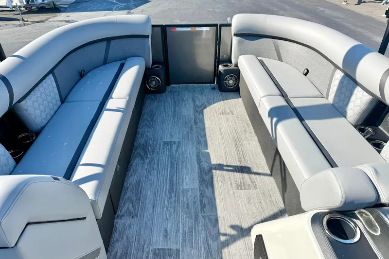 Slide: The Image of 2026 Crest Conquest 235 SLSC boat interior with spacious seating and modern design. - 27