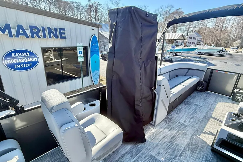 Slide: The Image of 2026 Crest Conquest 235 SLSC pontoon boat interior with seating and storage. - 30