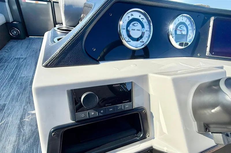 Slide: The Image of Dashboard of 2026 Crest Conquest 235 SLSC boat with gauges and controls. - 40