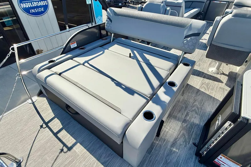 Slide: The Image of 2026 Crest Conquest 235 SLSC boat interior with gray seating and cup holders. - 44