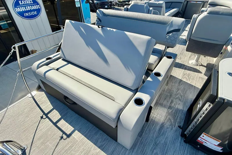 Slide: The Image of 2026 Crest Conquest 235 SLSC boat interior with gray seating and cup holders. - 47