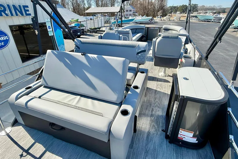 Slide: The Image of 2026 Crest Conquest 235 SLSC pontoon boat interior with modern seating and amenities. - 49