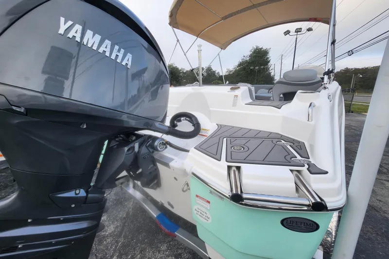 Slide: The Image of 2026 NauticStar 203 SC boat with Yamaha engine, featuring a sleek design and comfortable seating. - 2