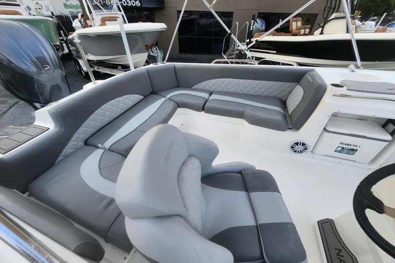 Slide: The Image of 2026 NauticStar 203 SC boat interior with gray seating and modern design. - 4