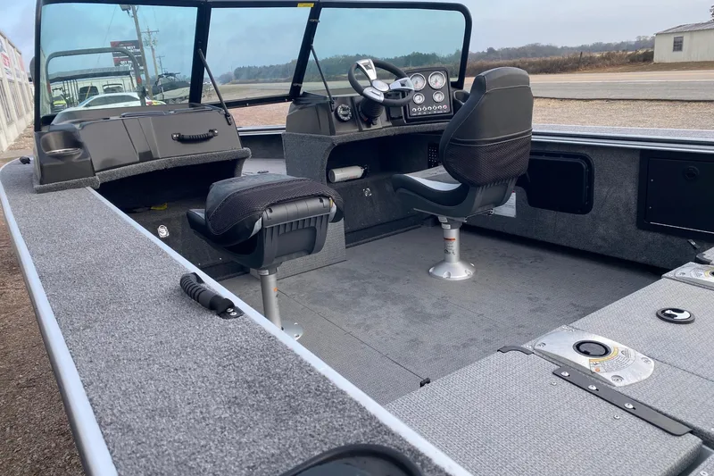 Slide: The Image of 2026 G3 Angler V1850 SF boat interior with seating and dashboard view. - 10