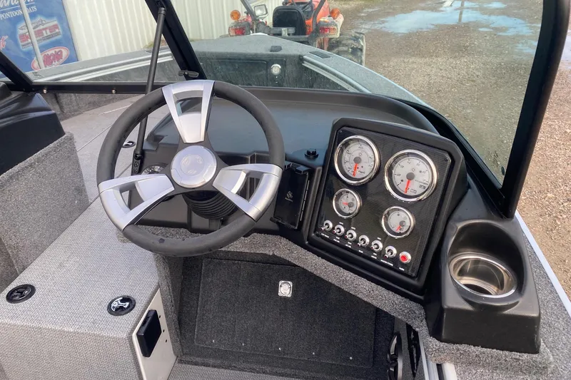 Slide: The Image of 2026 G3 Angler V1850 SF boat dashboard with steering wheel and gauges. - 7