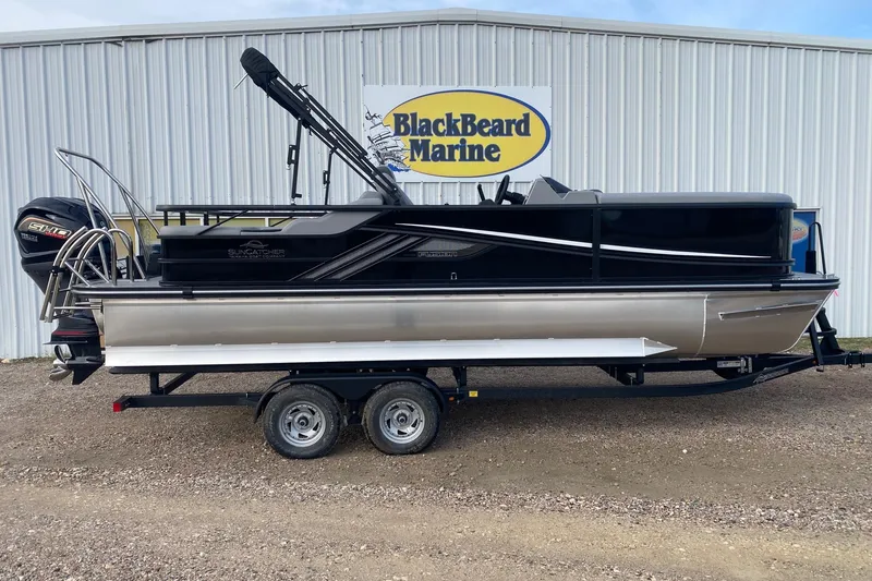 The Image of 2026 SunCatcher Fusion 322SS pontoon boat on trailer at BlackBeard Marine dealership. - 1