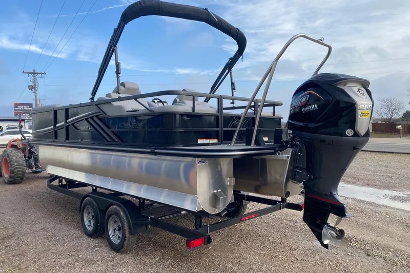 Slide: The Image of 2026 SunCatcher Fusion 322SS pontoon boat with Yamaha outboard motor on trailer. - 4